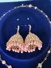 Rose Gold Jhumka Earrings And Necklace And Bracelet With Pink Beads Set