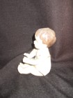 Antique Or Vintage Piano Baby Or Figurine   Bisque Porcelain             shelf  